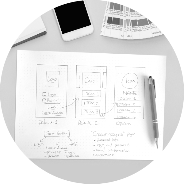 Desk showing hand drawn first sketch design for a web site