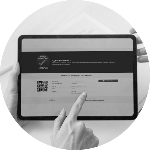 A tablet screen showing the Redox Software Cyber Essentials certificate