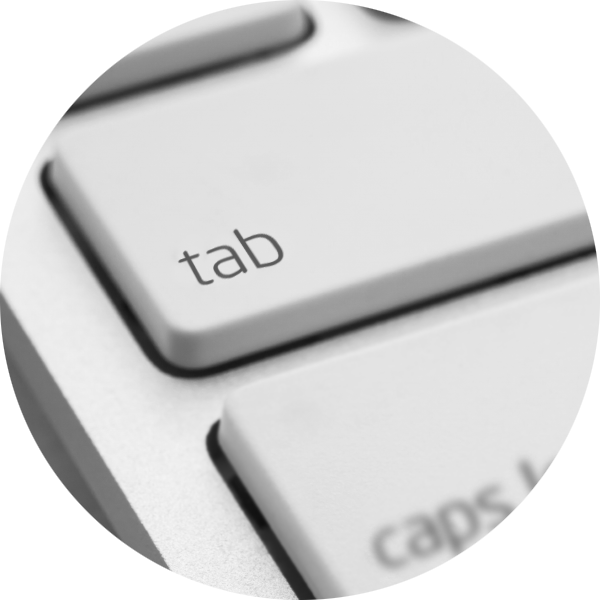 A keyboard showing the tab key highlighted to move between buttons on an accessible website