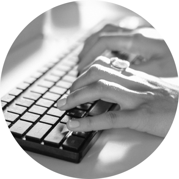 A woman typing on a separate keyboard