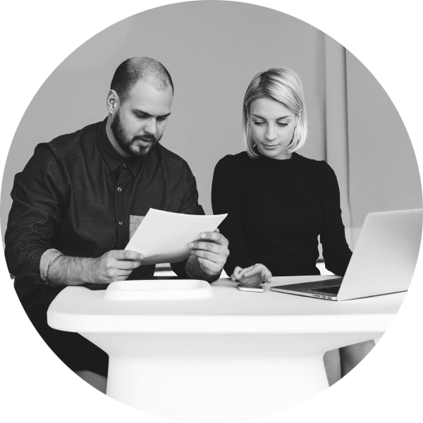 Man and woman reading through document