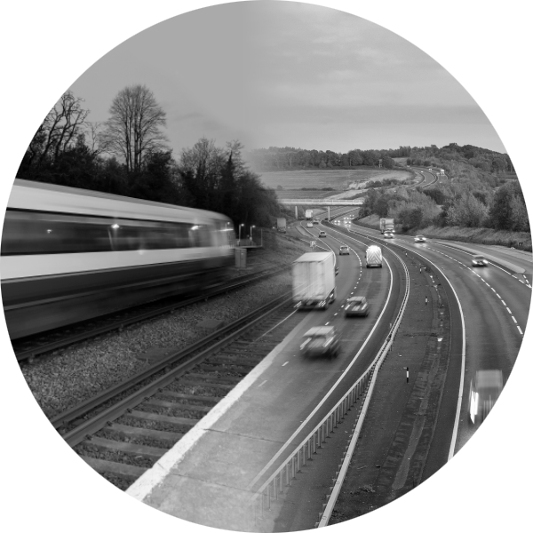 Fast moving train and motorway traffic