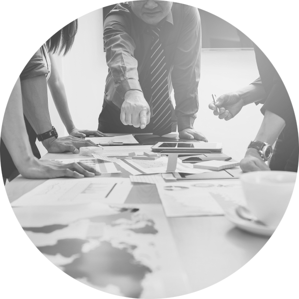 A group of business people gathered around a table at a business planning meeting